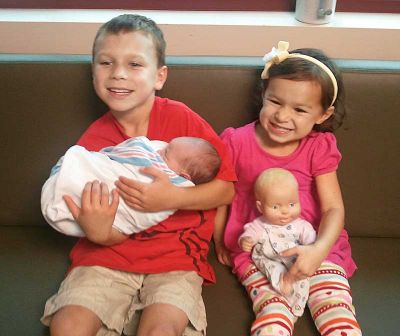 Big brother Baine and big sister Aida Lynn with their little brother Alexander Mathis Thompson. Big brother Baine and big sister Aida Lynn with their little brother Alexander Mathis Thompson.