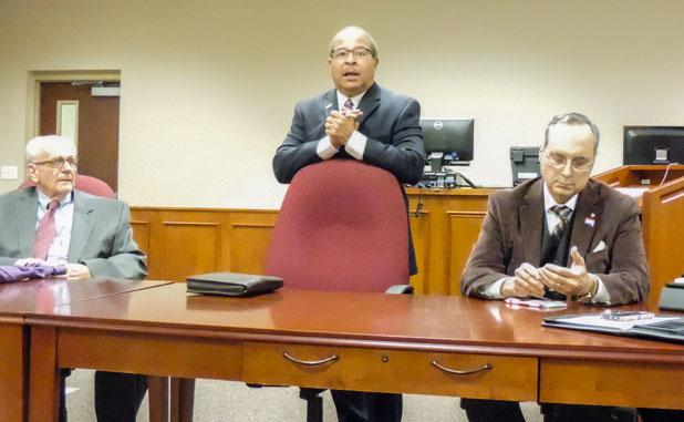 Fayetteville Mayor Ed Johnson conducts a town hall meeting, flanked by (L) council members Jim Williams and (R) Paul Oddo. Photo/John Thompson.