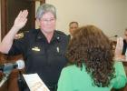 New Peachtree City Police Chief Janet Moon is sworn-in by Mayor Vanessa Fleisch at the Aug. 20 meeting of the Peachtree City Council. Photo/Ben Nelms.