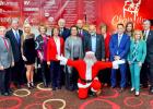 Chair-ity hosts celebrate Christian City event — Along with Santa, 2015 Chair-ity hosts gather at the event stage at Dolce/Aberdeen Woods in Peachtree City on Dec. 3. From left, Glenn Valencia, Randy Hall, Janet Hall, Vicki Turner, Janet McGregor Dunn, Greg Dunn, Myrna Barron, Sid Barron, Dr. M.A. Jaleel, Debi Lenox, Chris Allessio, Mimi Cawood, Heidi Becker, and Sen. Marty Harbin. The 9th annual event raised more than $100,000 for The Children’s Village at Christian City. Photo/Christian City.